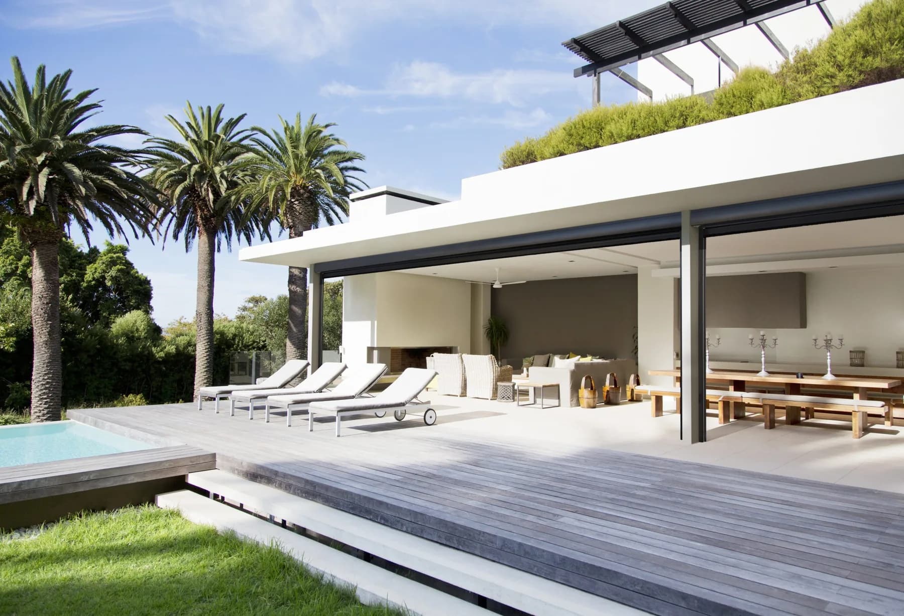 Progressive MagnaTrack motorized screen on a modern coastal patio