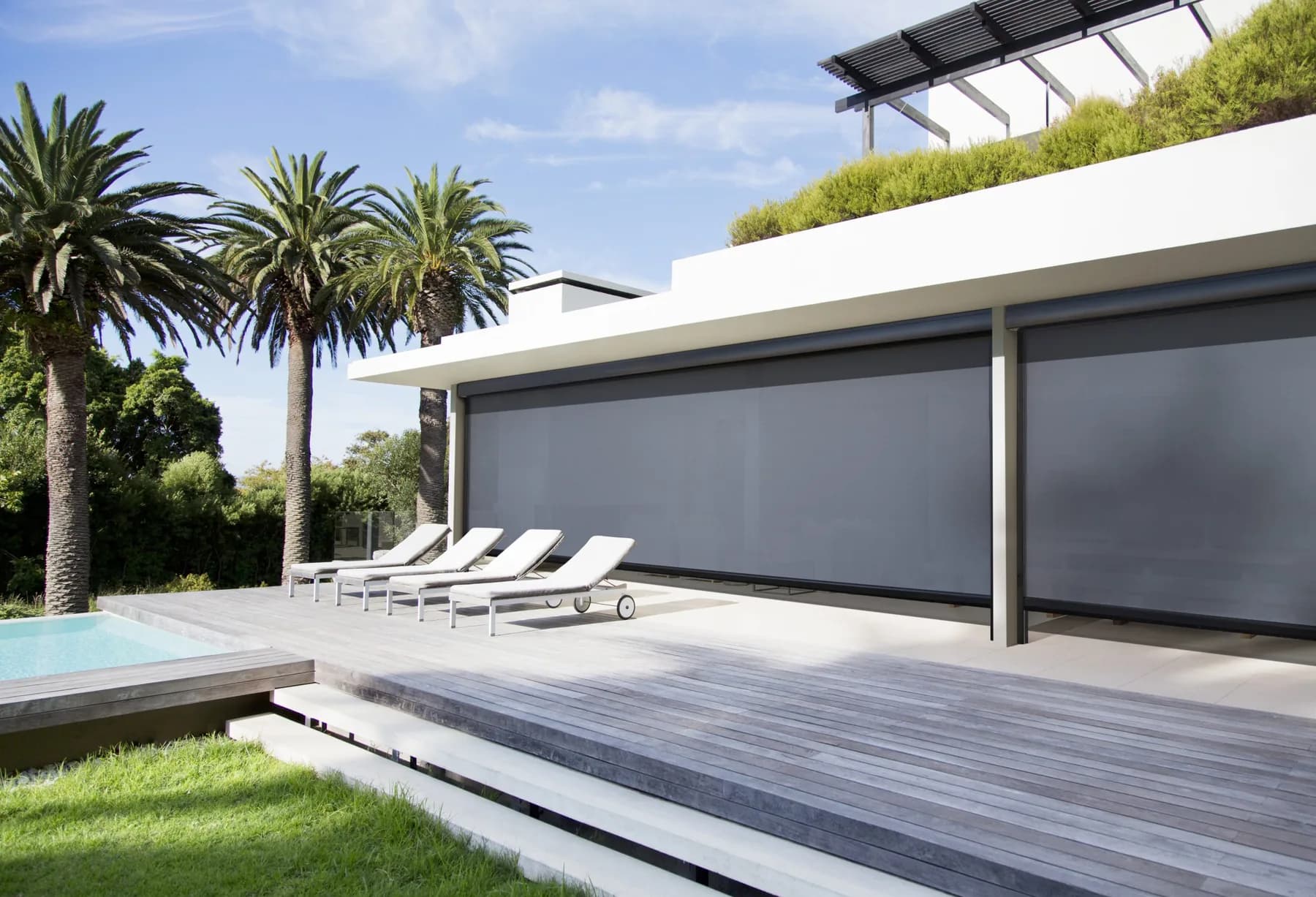 Progressive MagnaTrack retractable screen installed on a luxury patio